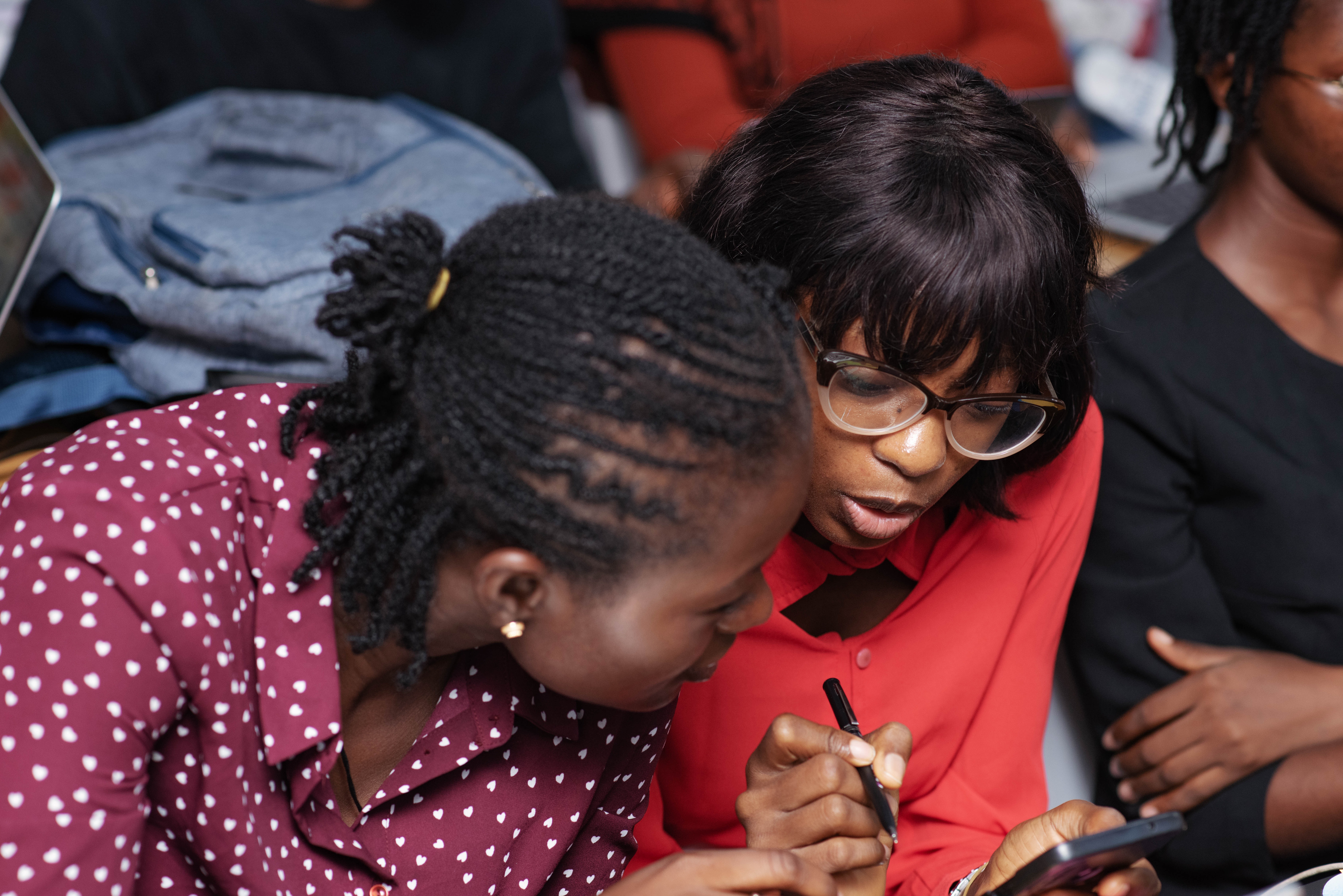Team meeting at whiteboard